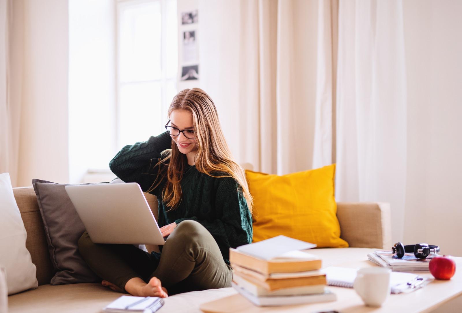 Woman using laptop at home